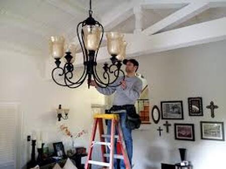 electrician fixing lighting