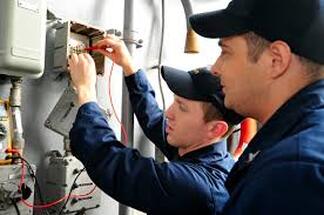 Electricians at junction box